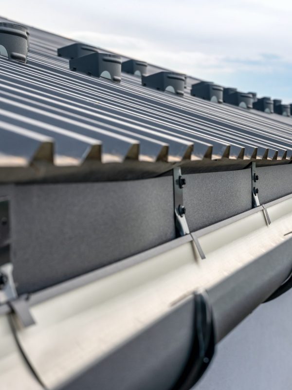 Gutter system on a metal roof